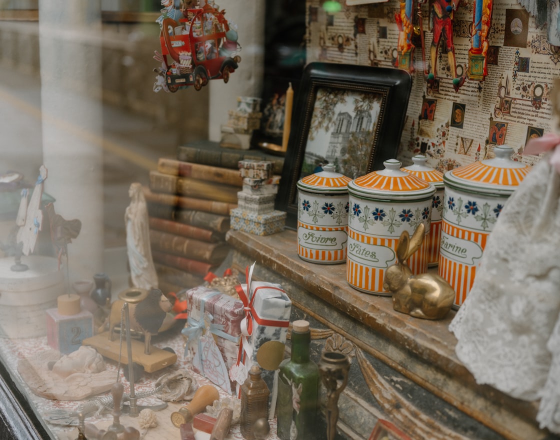 A curated arrangement of collectible miniatures, small trinkets, and vintage finds
